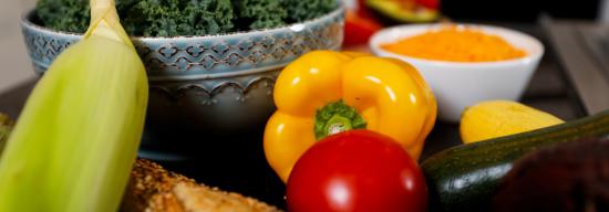 Collection of fruits, vegetables, and herbs on a table