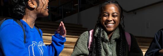 Three African American female students laughing together