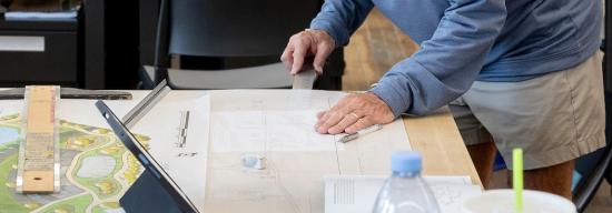 Person working on an architectural drawing