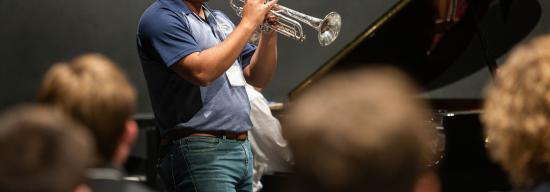 Student playing the trumpet during a concert