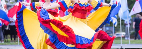Latin performer dancing at a Latinx celebration