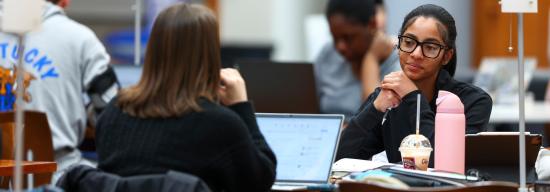 Students talking inside the Gatton College of Business and Economics