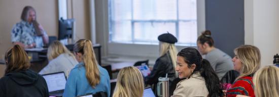Students talking in a classroom during lecture