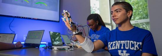 Female student testing out a biomedical object
