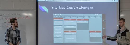 Two male students giving a presentation on Interface Design Changes
