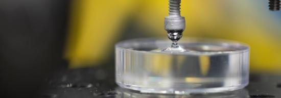 Cylindrical glass being pressed