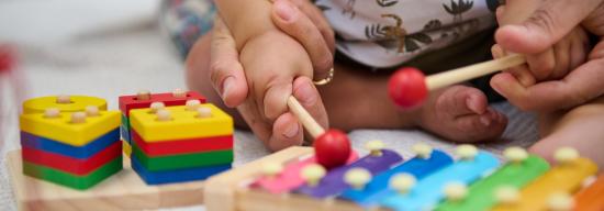 Child playing with musical blocks