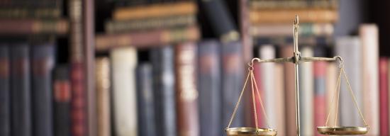 Scales with books in the background