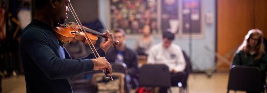Student playing violin