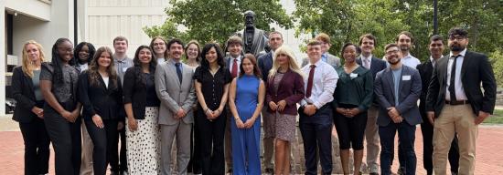 A group of Patterson students outside a UK building.