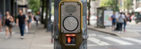 Close up of an audio and visual display of crosswalk button.