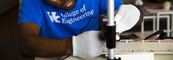 student working on aircraft pieces
