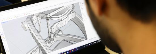 Student looking at a 3D design on his computer