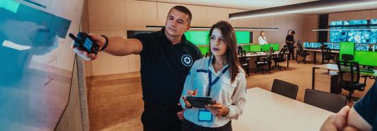 Male training a new female employee