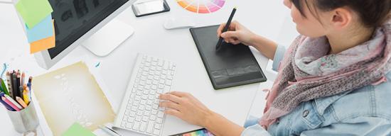 Female making a design on a white desk