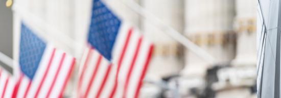 American flags hanging from a building