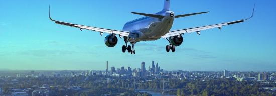 Plane going over a city